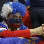 Sporting the colors of the Motherland, this sad-faced fan sported the face of Russia after its hockey team was eliminated.